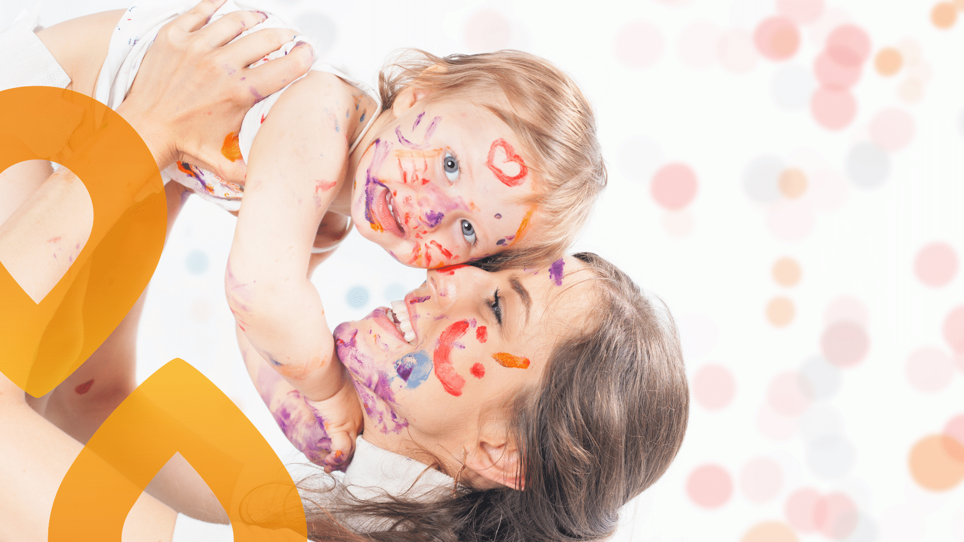 Vauva ja aikuinen maalin peitossa